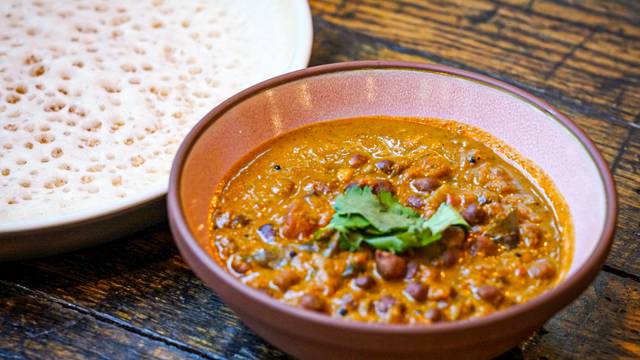Thattu signature dishes Kadala Curry with PuttuAppam with Egg CurryFish Fry